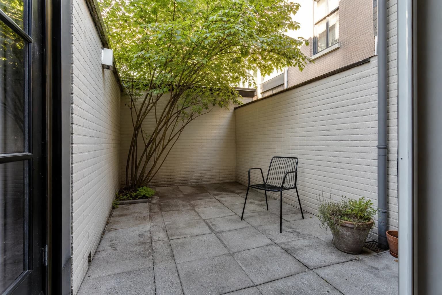 Small enclosed patio before landscape design