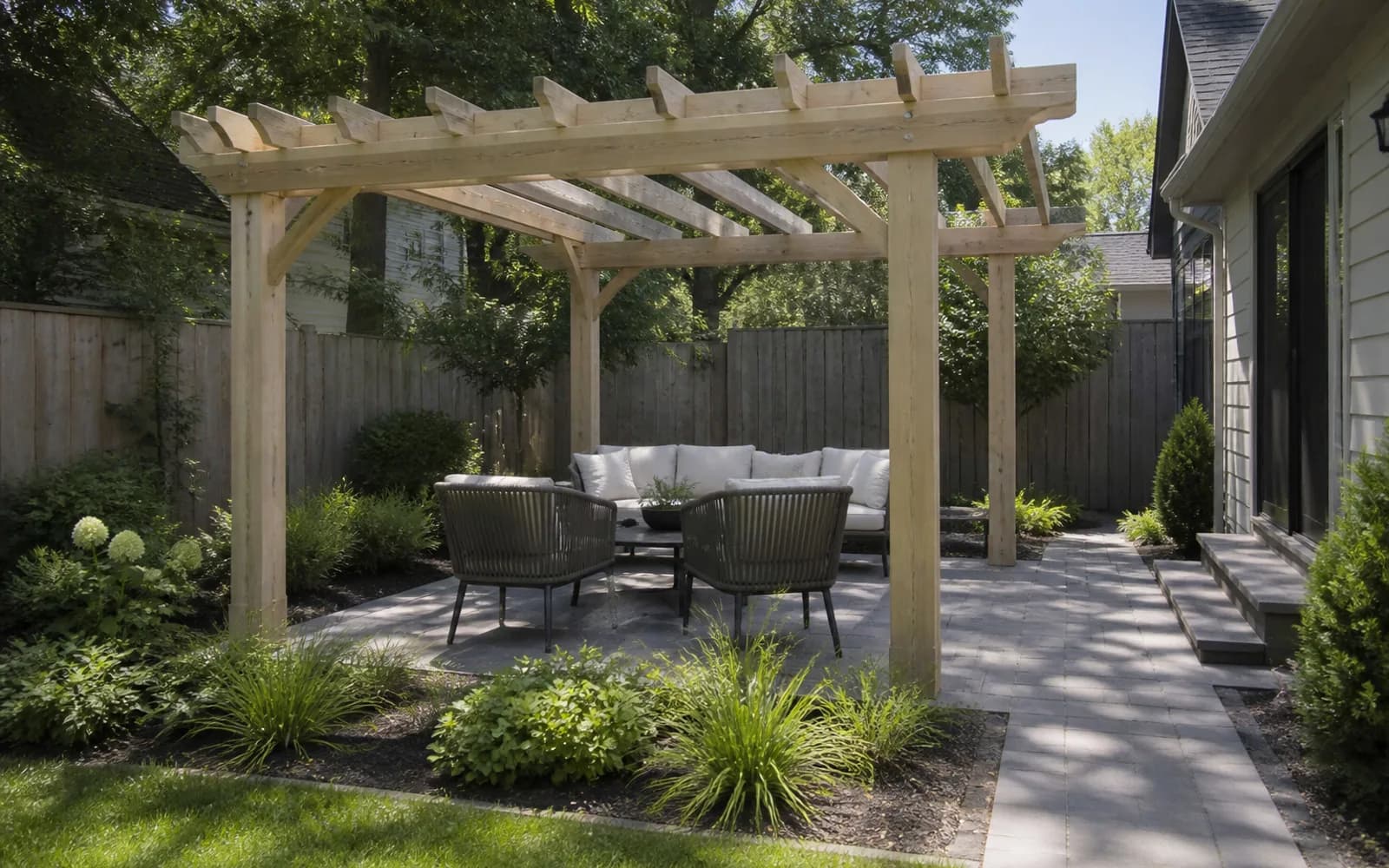 Small backyard landscaping inspiration: Define one outdoor room with a light pergola