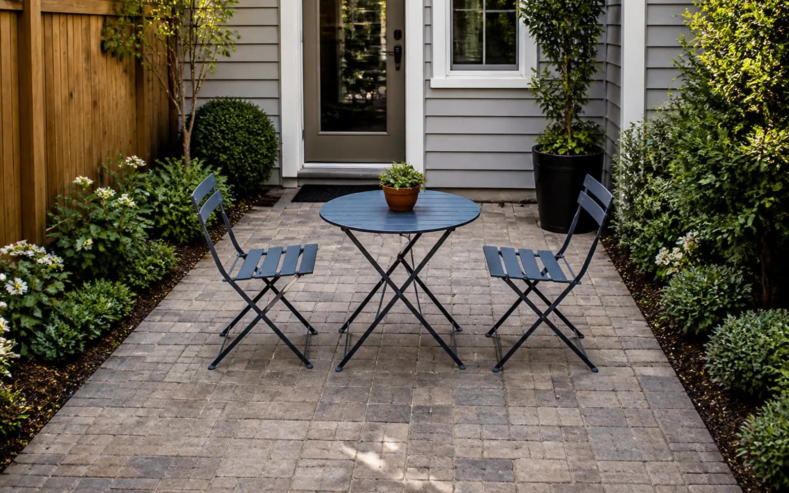 Small backyard landscaping inspiration: Choose a folding table that works for two and expands