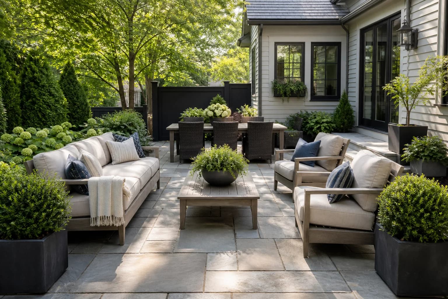 A compact patio with planting and comfortable seating